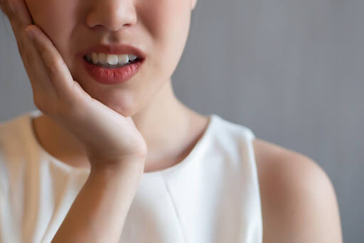woman has tooth pain