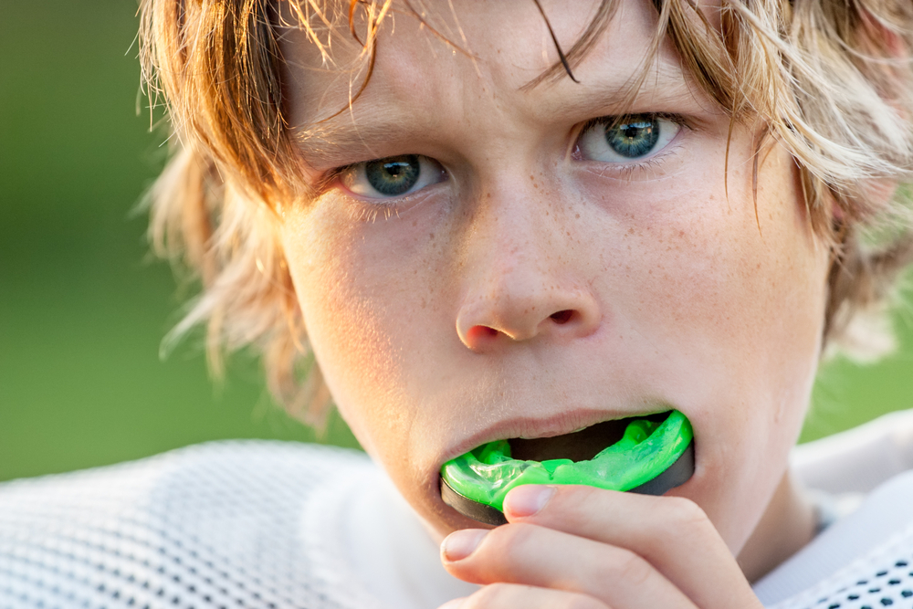 young athlete with mouthguard