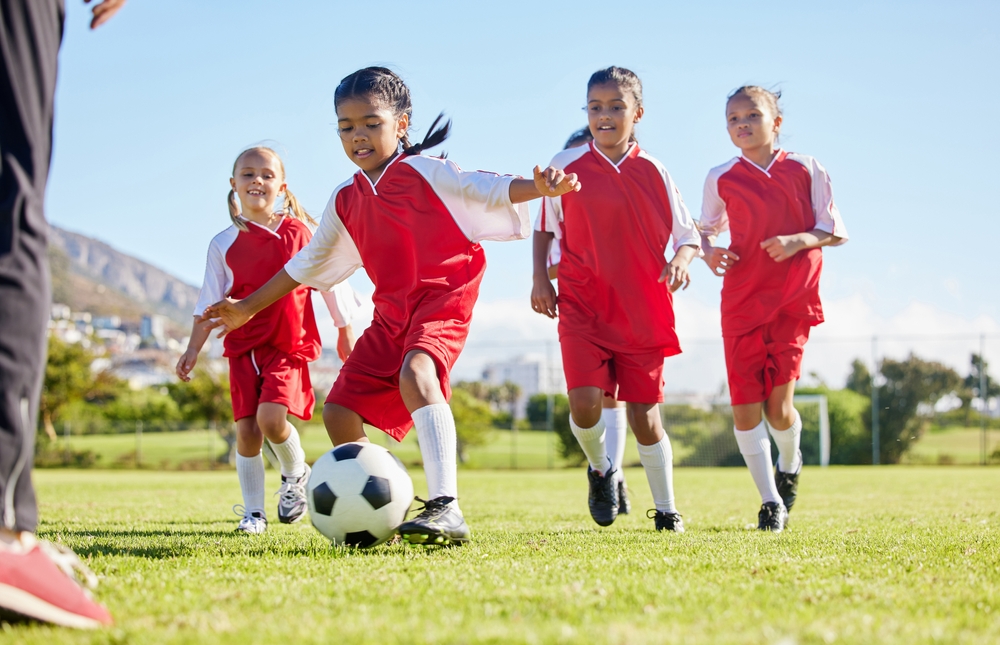young girls playing soccer