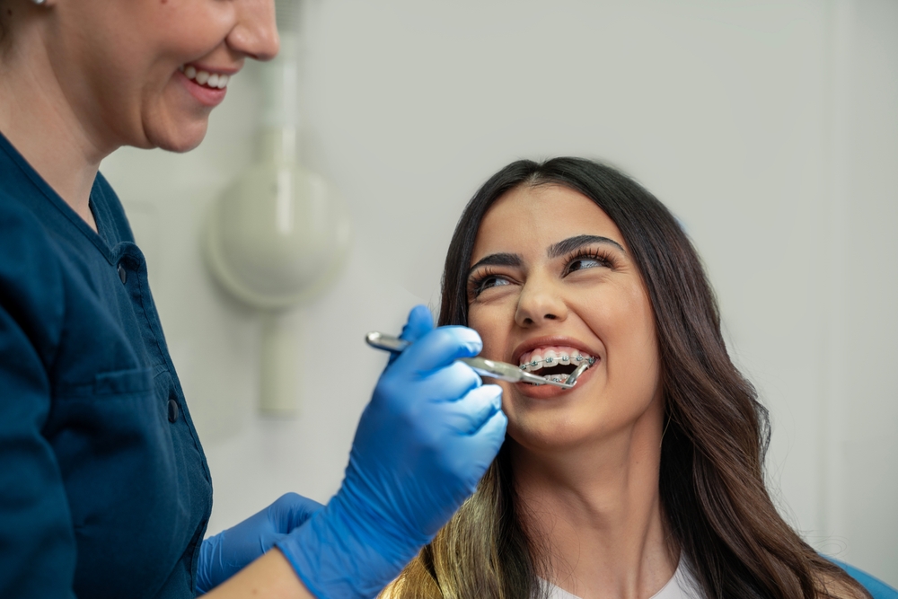 Closeup,Shot,,Cute,Young,Woman,With,Dental,Braces,Smiling,While orthodontic care Citrus Smiles Dental Studio