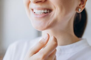woman with clear aligners