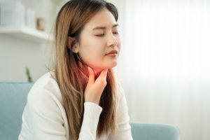 woman with sore throat